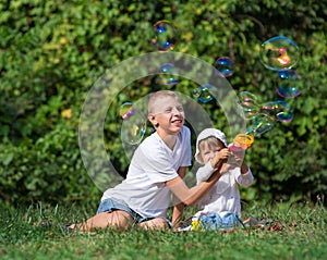 Children blow bubbles