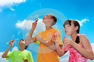 Children blowing bubbles