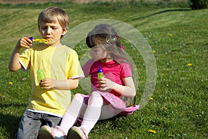 Children blowing bubbles