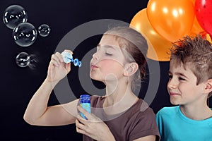 Children blowing bubbles