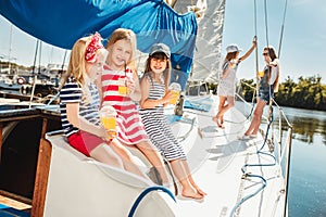 The children on board of sea yacht