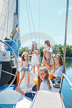 The children on board of sea yacht