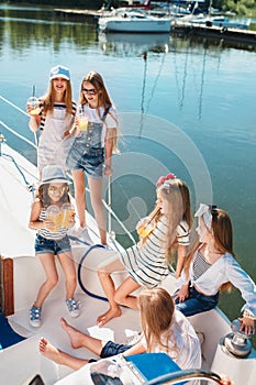 The children on board of sea yacht