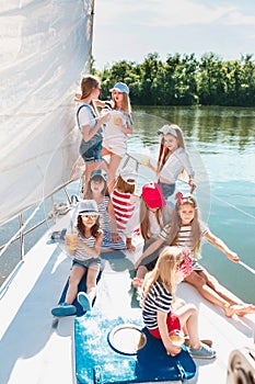 The children on board of sea yacht