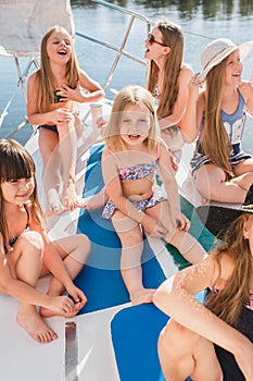 The children on board of sea yacht