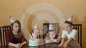 Children boring on birthday party. birthday cake for little birthday girl