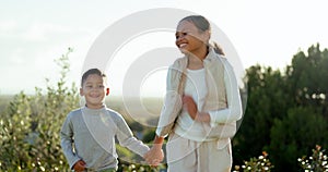 Children, boy and girl in park, holding hands and walking together with smile on face in summer sunshine. Siblings, kids