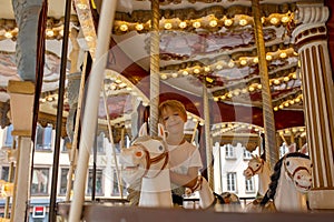 Children, boys, going on Merry Go Round, kids play on carousel in the summer