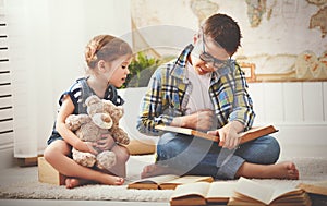 Children brother and sister, boy and girl reading a book