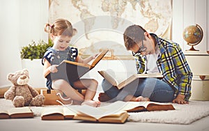 Children brother and sister, boy and girl reading a book