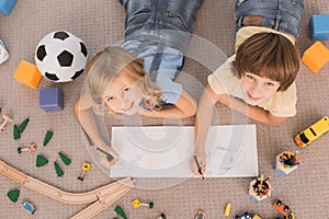 Children brother and sister family time together indoors