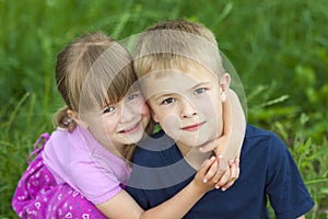 Children brother and sister hugging each other