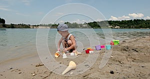 Children build sand castles near