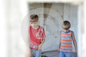 Children in a burnt house lost their homes as a result of hostilities and natural disasters