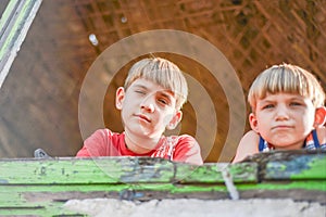 Children in a burnt house lost their homes as a result of hostilities and natural disasters