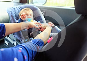 Children car chair. baby car seat for safety. Protection in the car. boy in the child seat