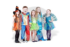 Children in carnival costumes stand