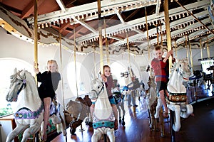 Children on a carousel photo