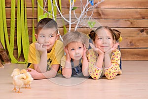 Children with chickens indoors