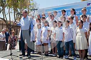 The children chorus prepares to sing