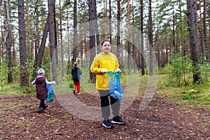 Children clear the forest of garbage. Instilling respect for nature