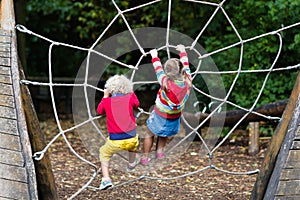 Children climb on school yard playground