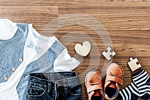 Children clothing on wooden background