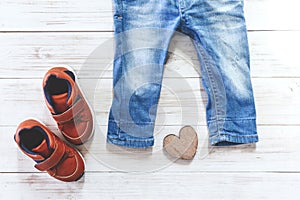 Children clothing on wooden background