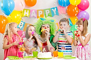 Children and clown at birthday party