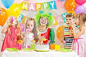 Children and clown at birthday party