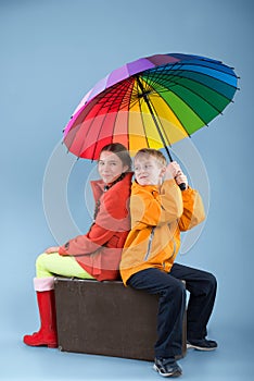 Children with a colorful umbrella