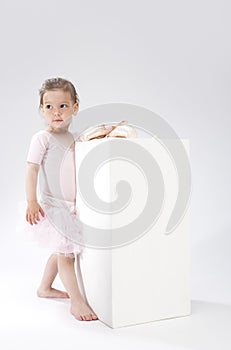 Children Concepts and Ideas. Little Cute Caucasian Girl Poses With Miniature Pointes