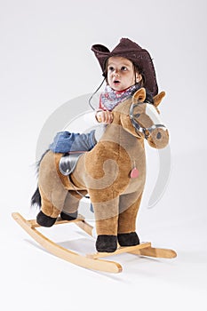 Children Consepts. Little Caucasian Girl Posing in Cowgirl Cloth photo