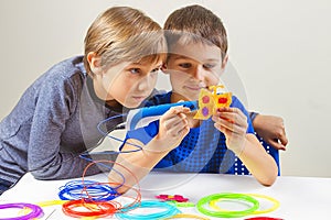 Children creating with 3d printing pen