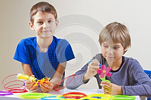 Children creating with 3d printing pen