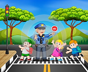The children cross the road while the police stop the transportation