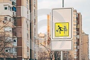 Children crossing in proximity of school traffic sign a warning and advising road users to drive extra slowly