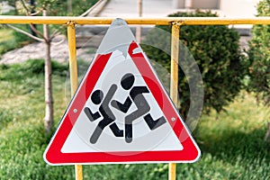 Children crossing road sign