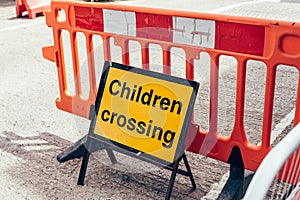 Children crossing road sign, London, UK