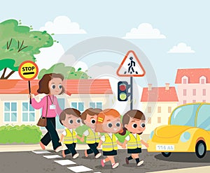 Children crossing the street by crosswalk
