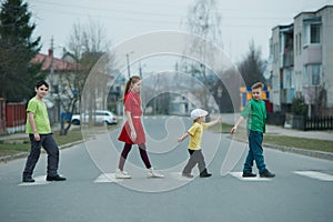 Children crossing street on crosswalk