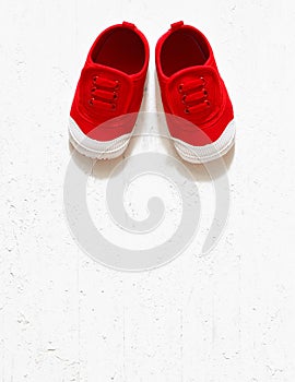 Children cute red small sized canvas shoes top view overhead s