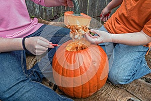 Children Cutting Open a Pumpkin