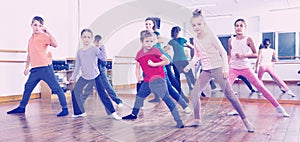 Children dancing contemp in studio smiling and having fun