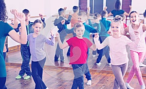 Children dancing contemp in studio smiling and having fun