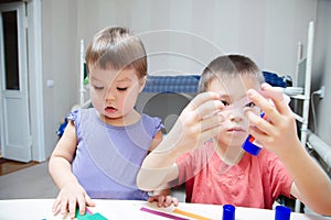 Children development - brother and sister crafting