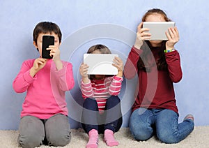 Children with devices photo