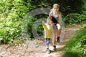 Children of different ages get lost in the forest and are very worried. They stand on the forest path and think where to go next