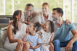 Children, diversity and big family in portrait in a home in Australia with mother, father and grandparents laughing. Old