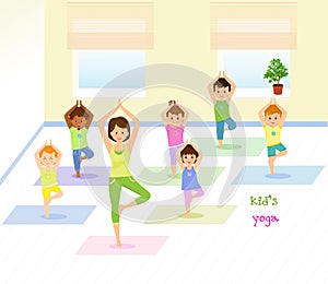 Children do yoga with a yoga instructor in studio